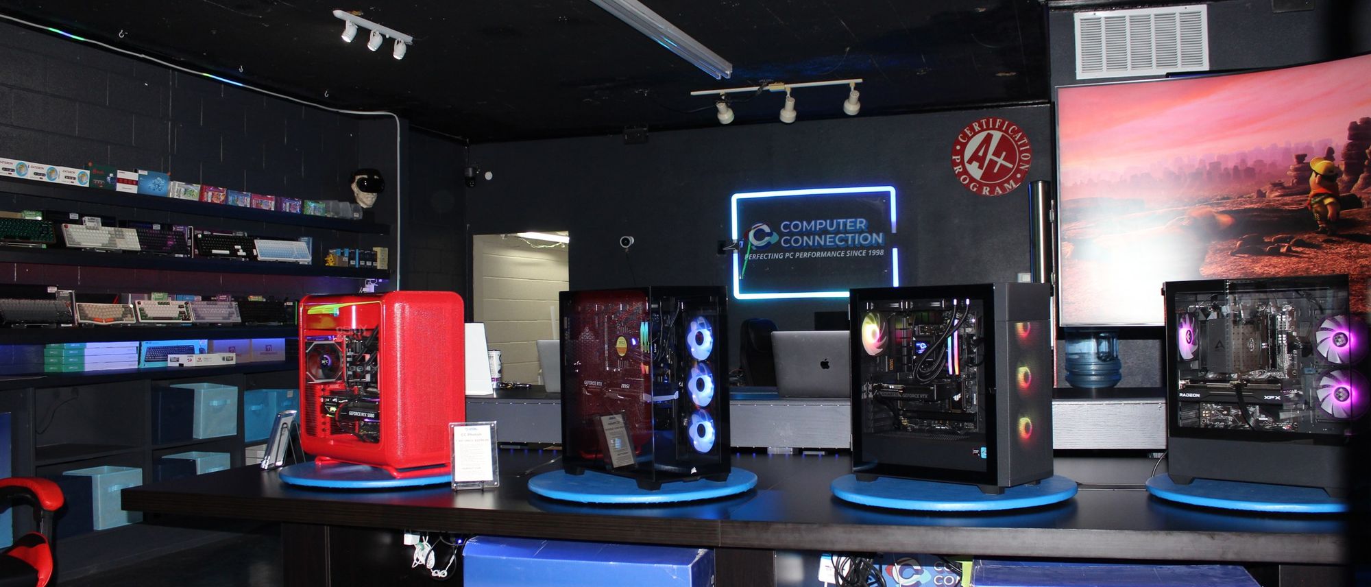 Inside Computer Connection: the showroom, service counter area, and our neon sign
