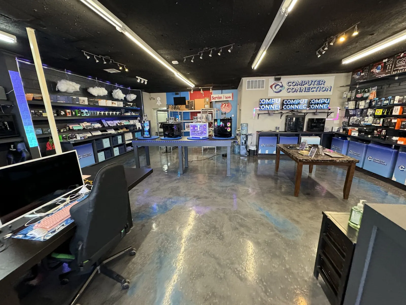 Inside the Computer Connection store on N May Ave: parts walls, build tables and the service counter